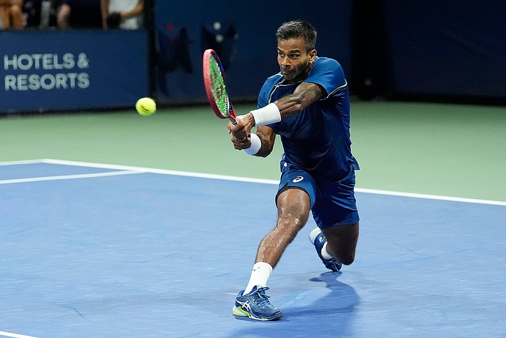 | Photo: AP/Matt Rourke : 2024 US Open: Sumit Nagal returns a shot to Tallon Griekspoor